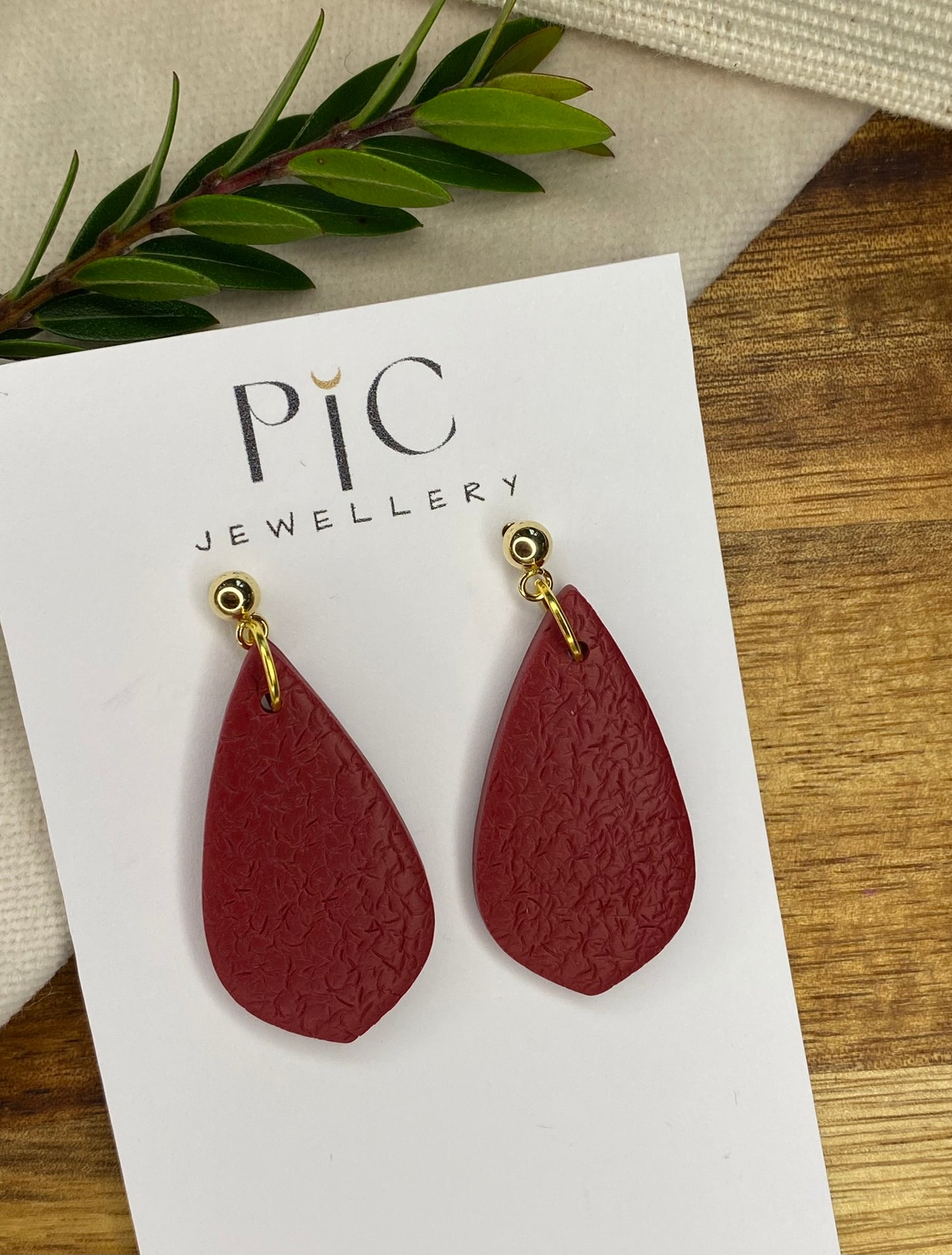Medium dangles - textured burgundy teardrops