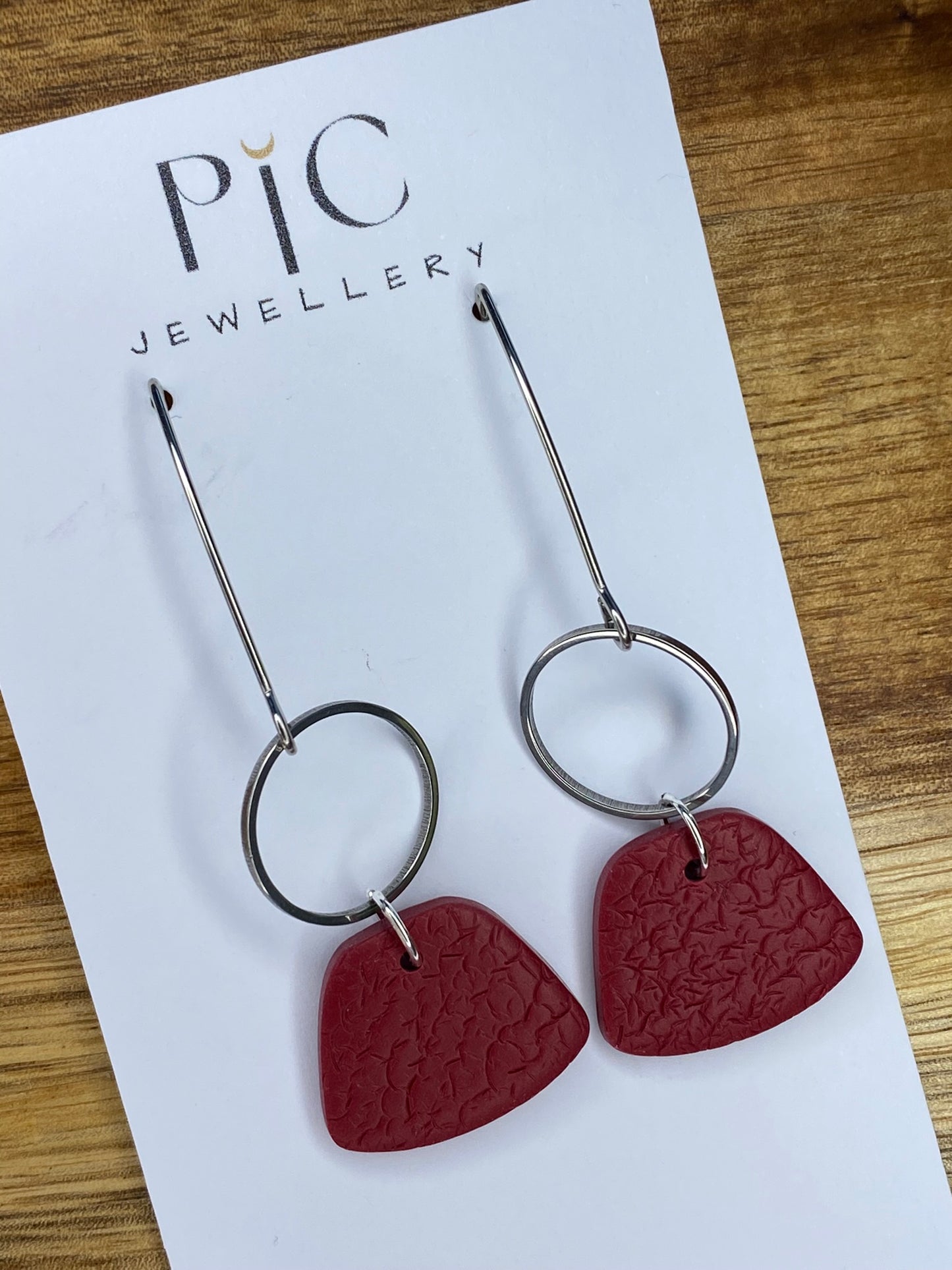 Statement dangles - textured burgundy rounded trapezium and silver circle