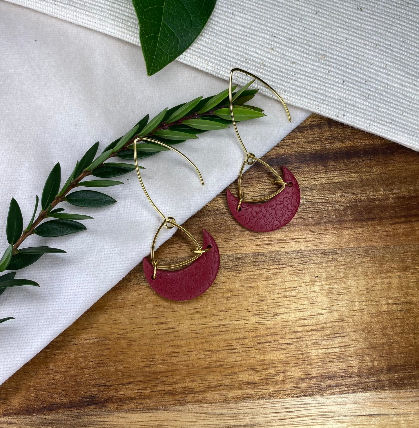 Statement dangles - textured burgundy moons with gold triangle
