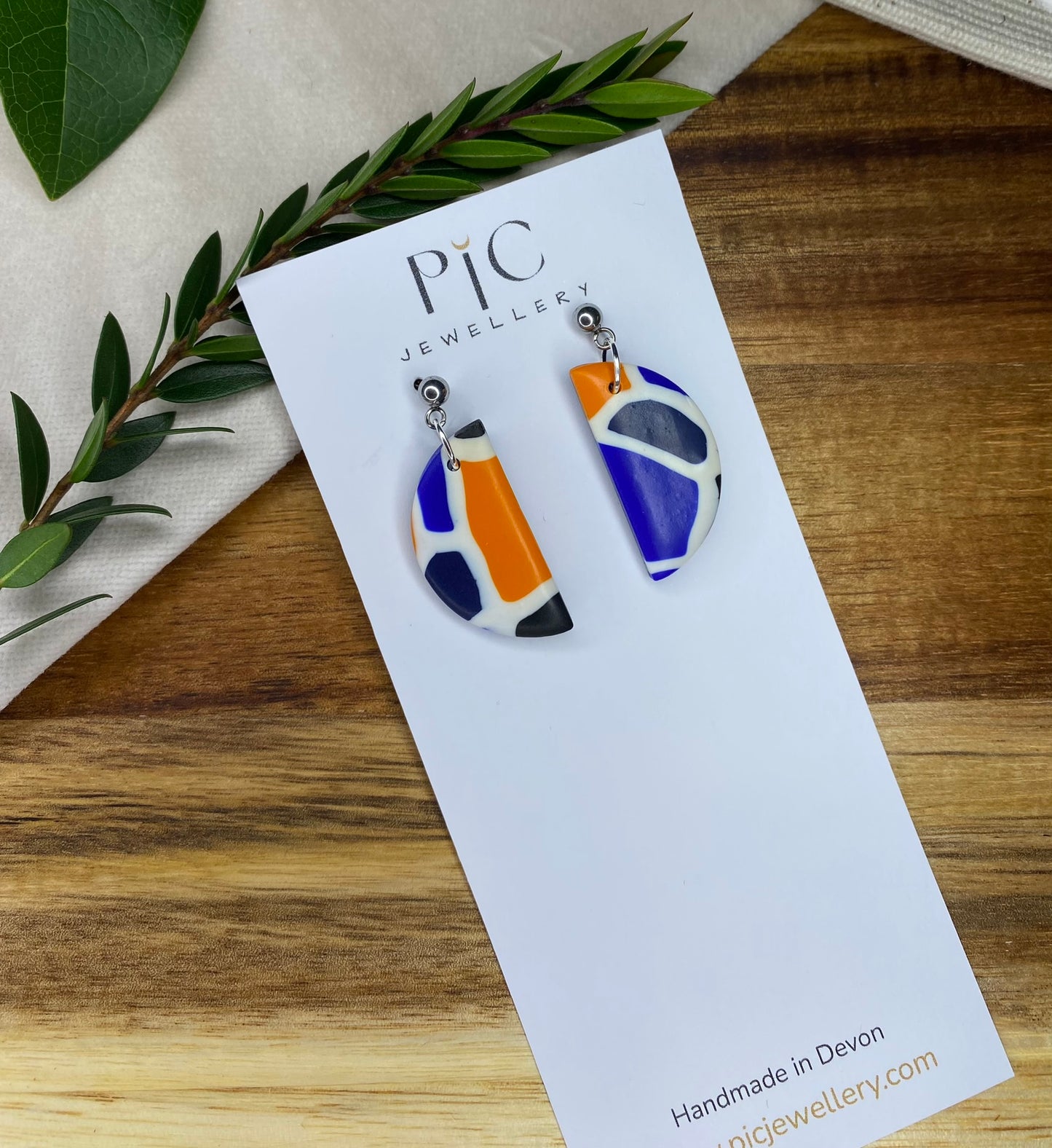 Medium dangles - blue, orange, white and black mix semi-circles