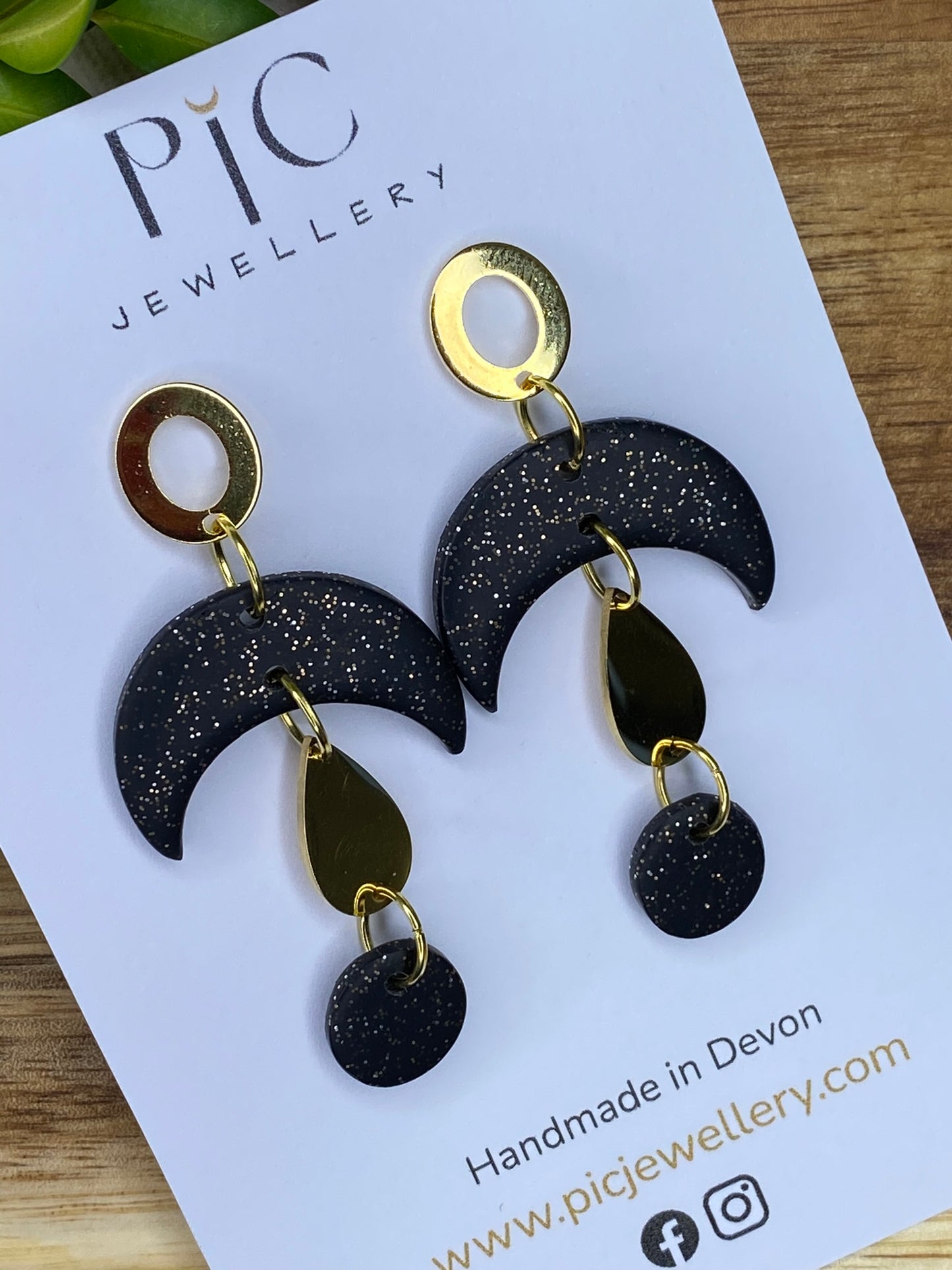 Statement dangles - black and gold glitter moons with gold metal teardrop