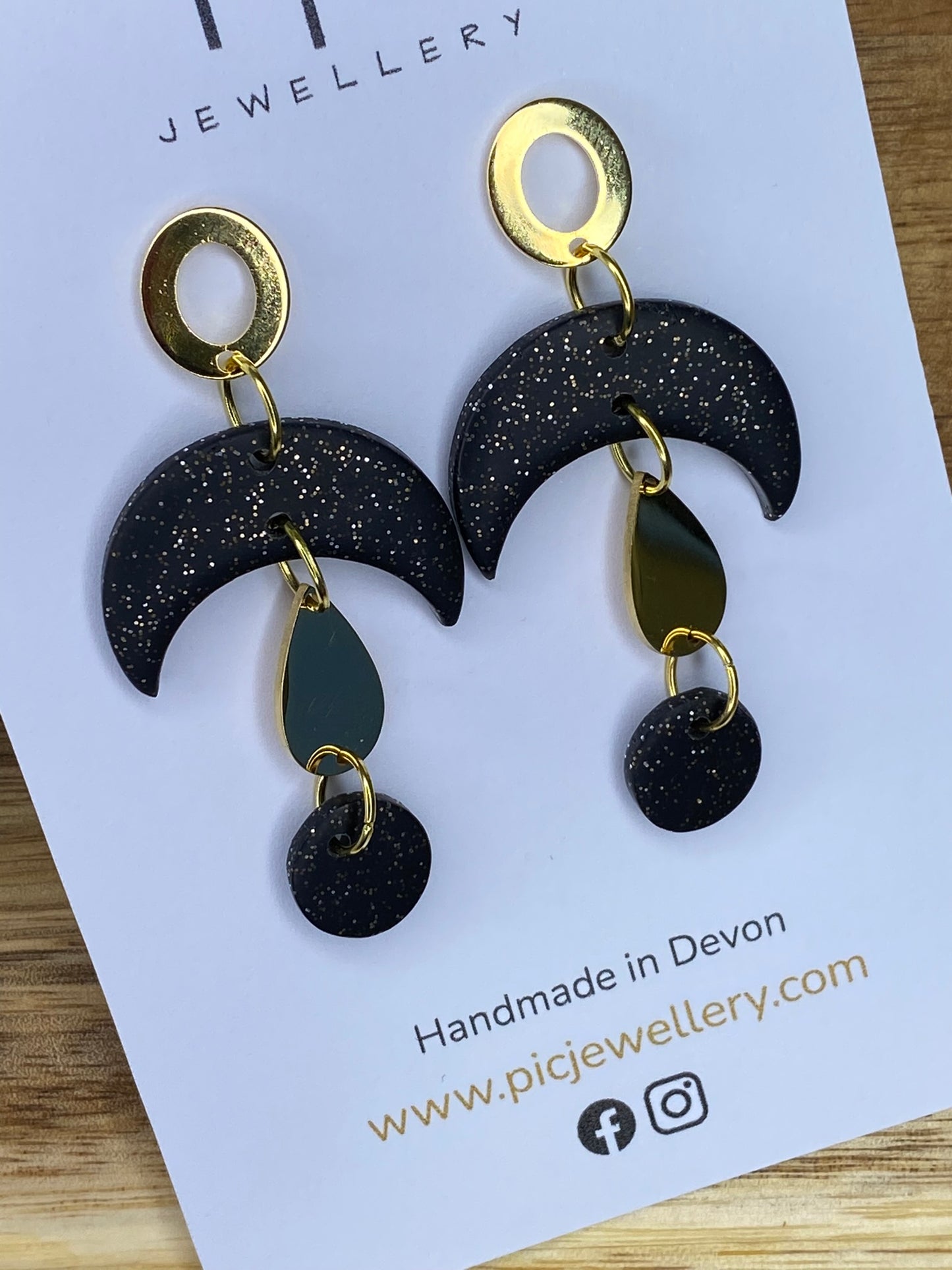 Statement dangles - black and gold glitter moons with gold metal teardrop