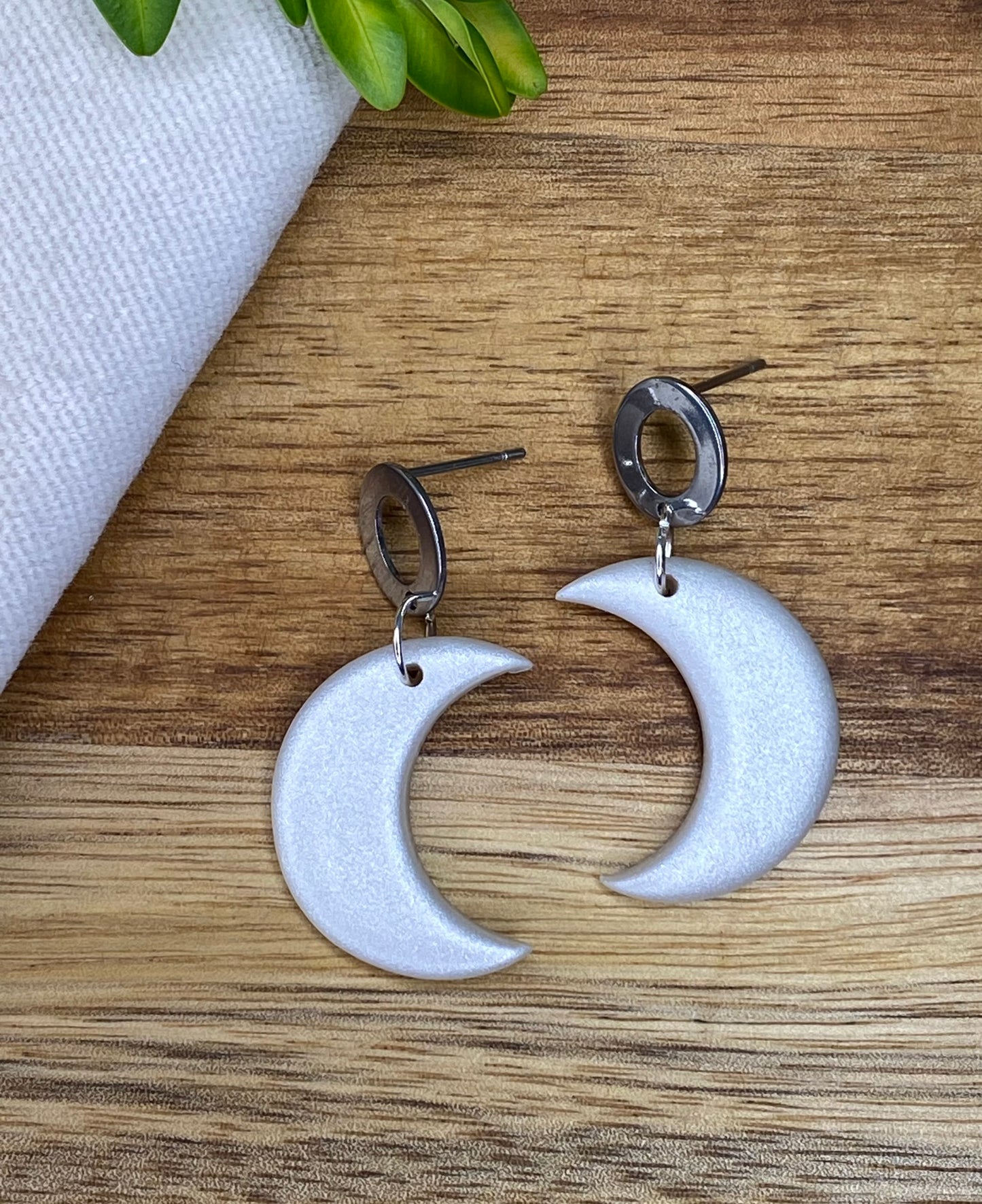 Medium dangles - pearlescent crescent moons with open oval stud