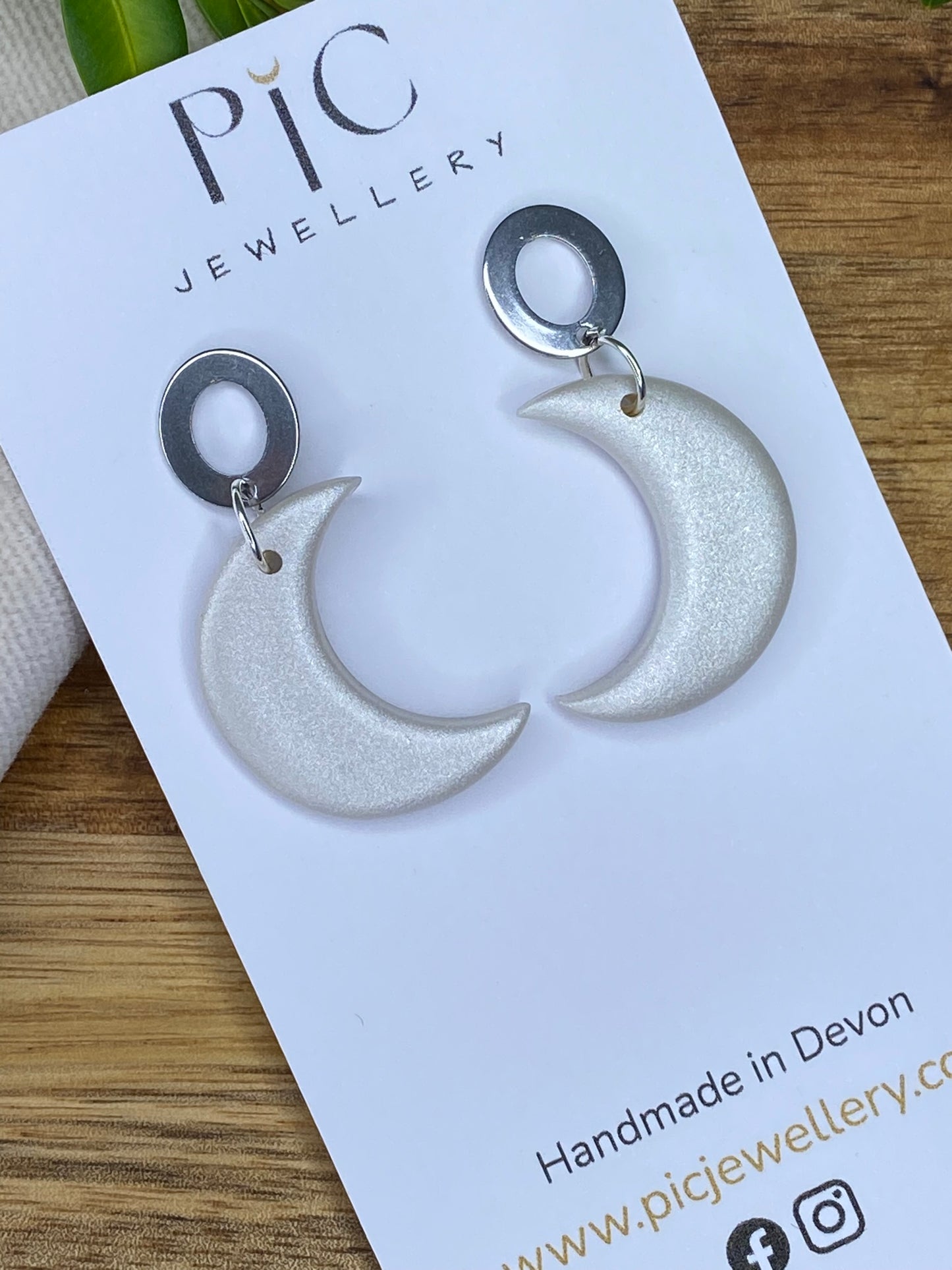 Medium dangles - pearlescent crescent moons with open oval stud