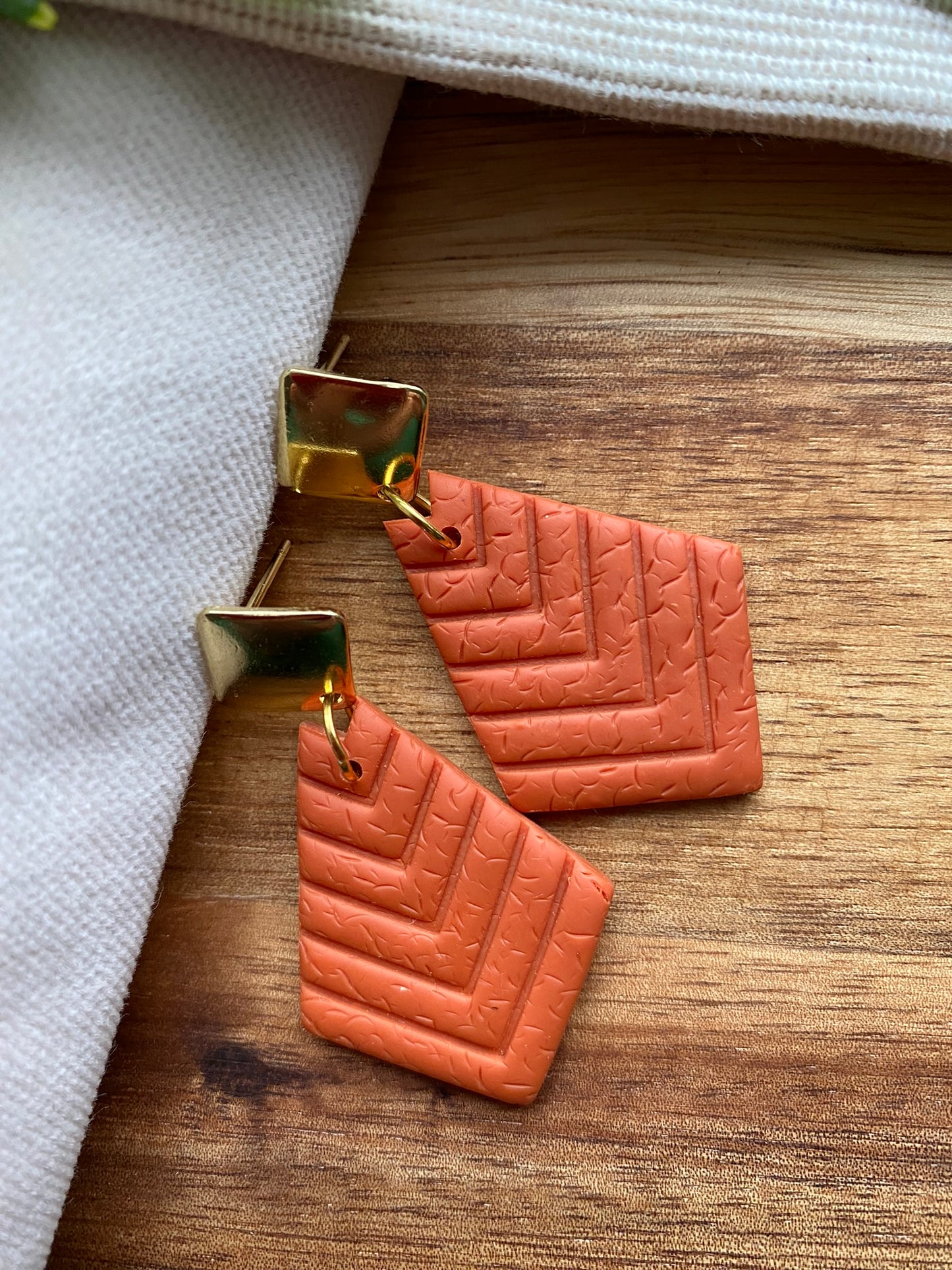 Medium dangles - orange chevron embossed diamond