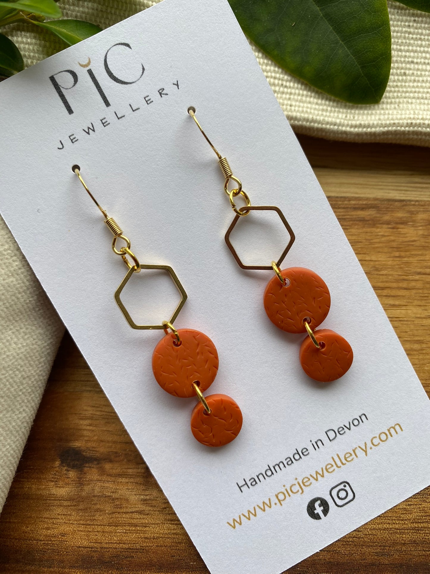 Statement dangles - textured orange circles and gold hexagon