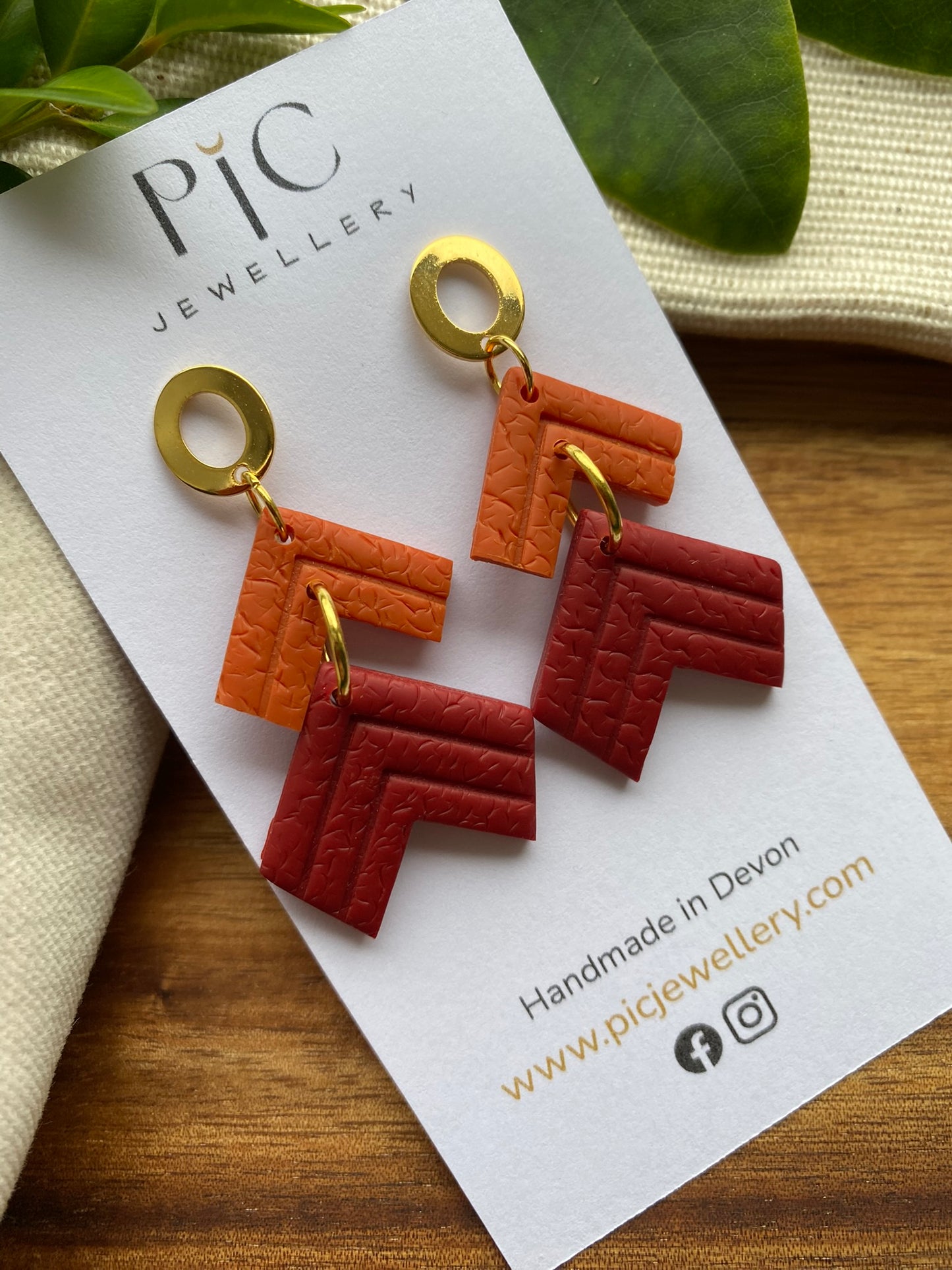 Statement dangles - textured orange and burgundy embossed chevrons