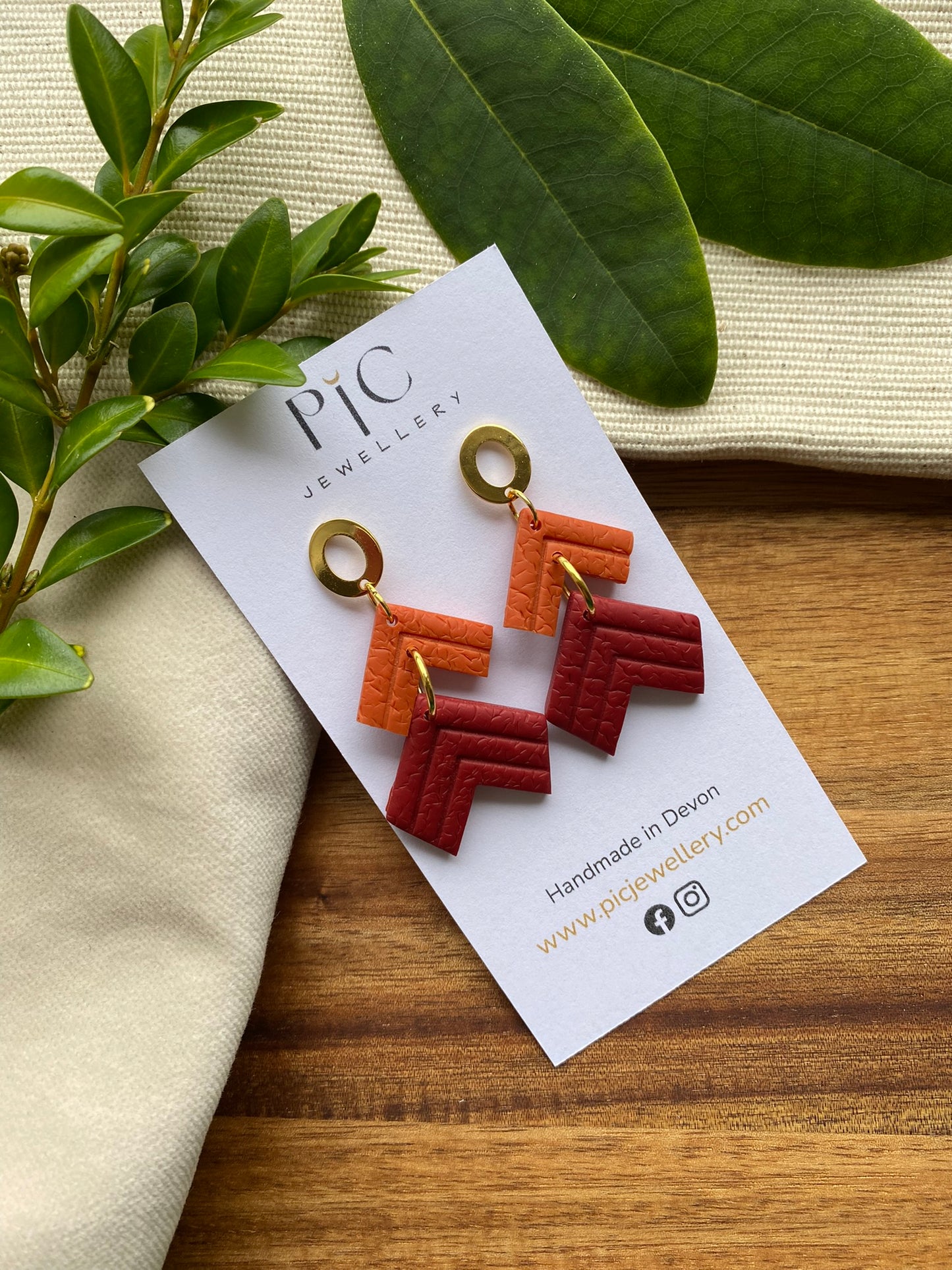 Statement dangles - textured orange and burgundy embossed chevrons