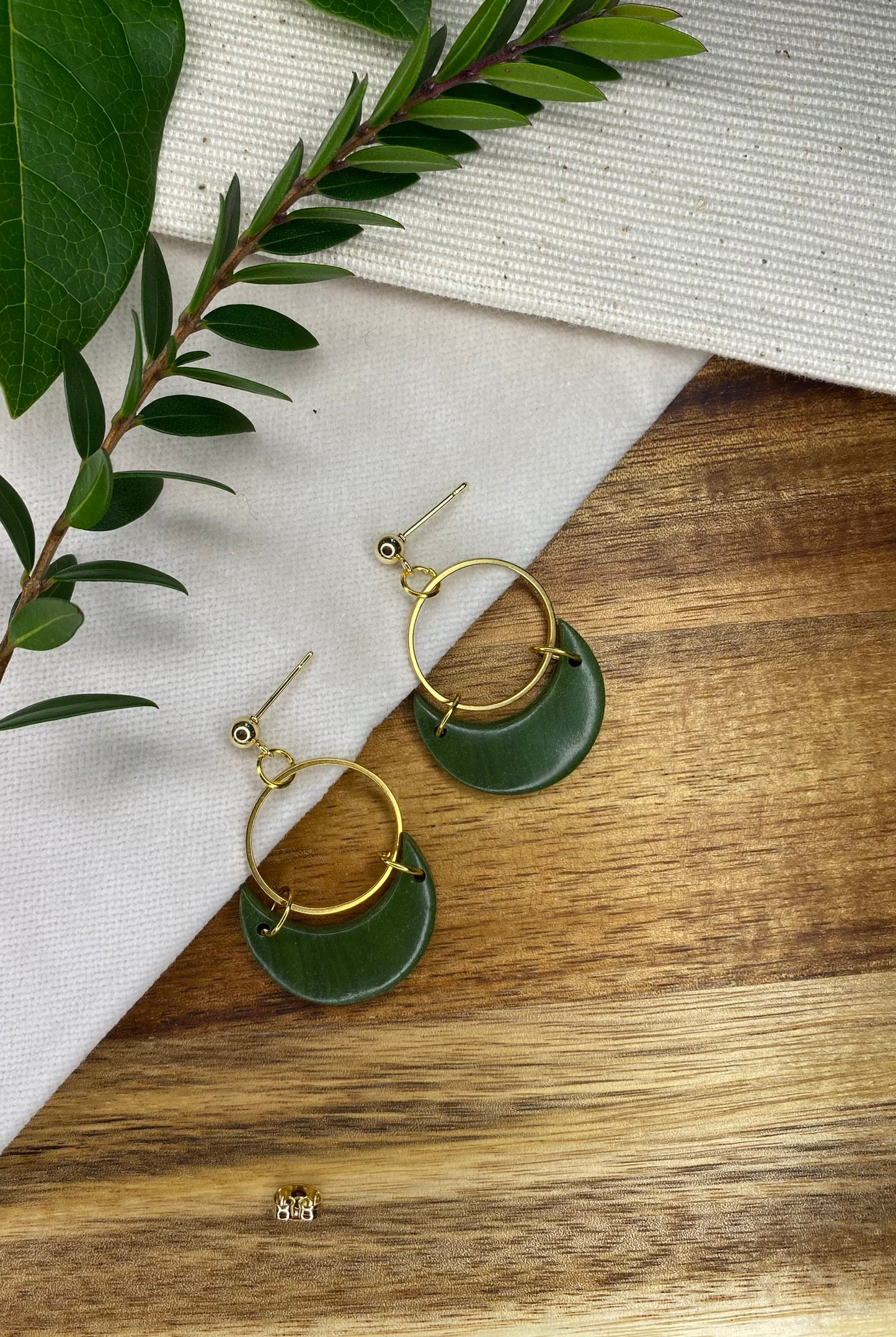 Statement dangles - green moons with gold circle