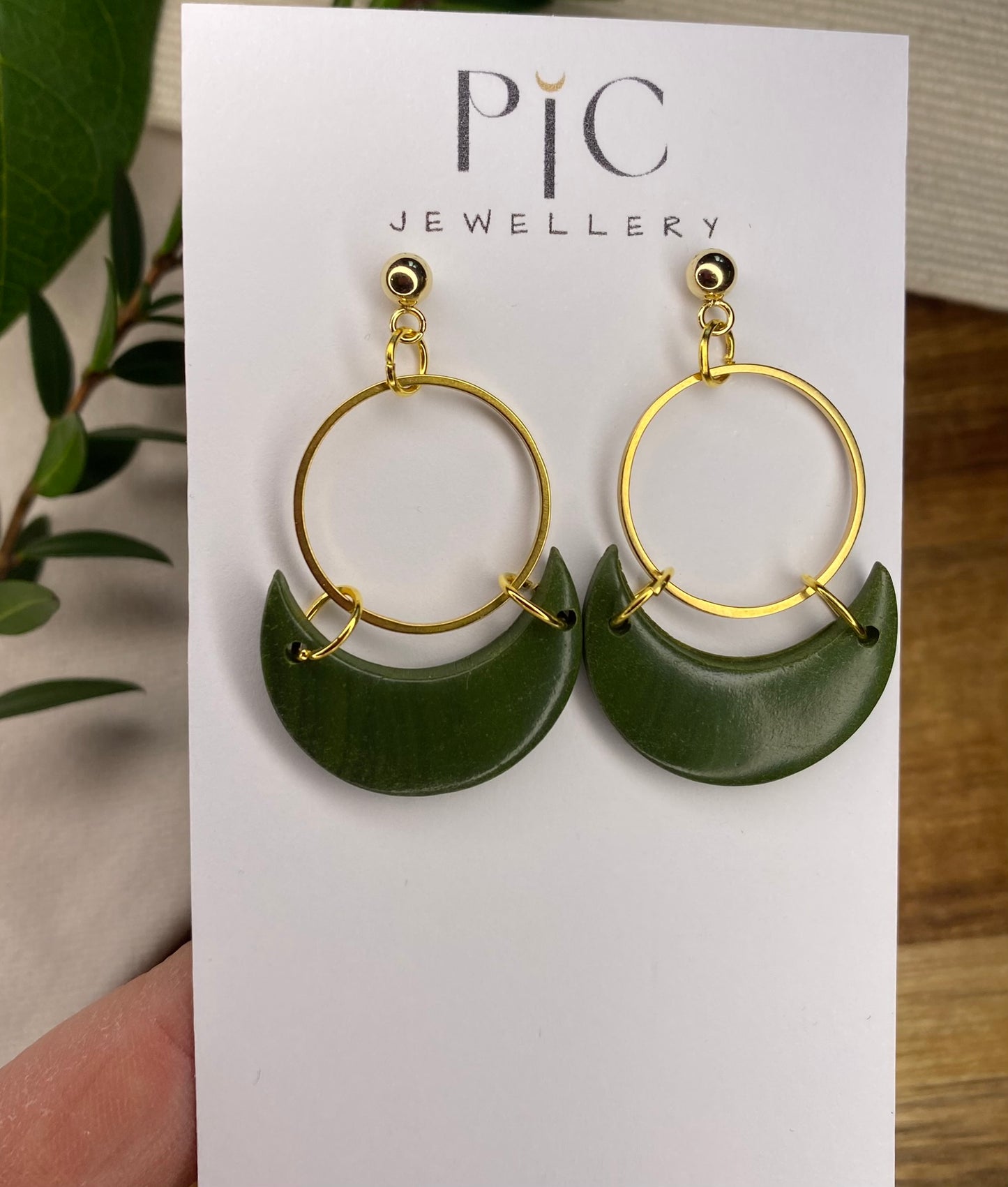 Statement dangles - green moons with gold circle