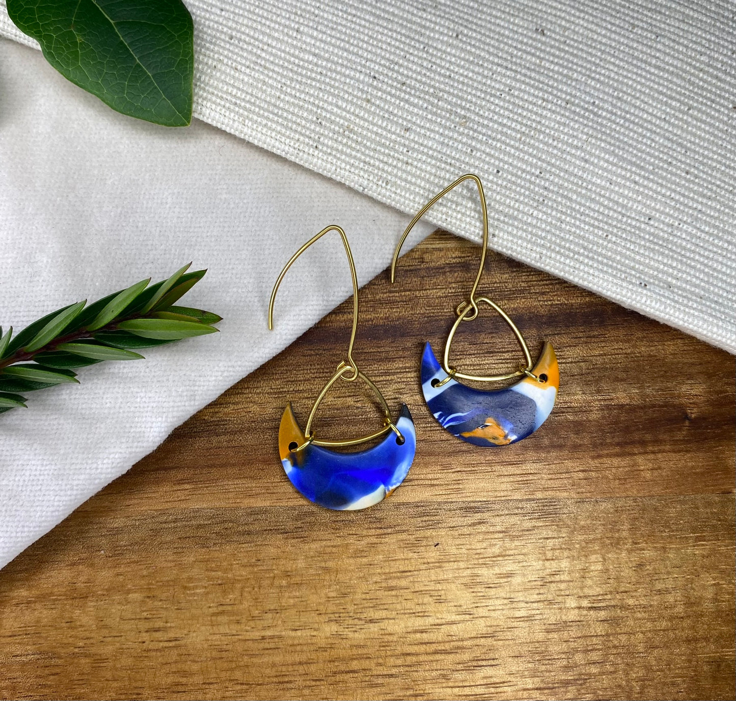 Statement dangles - blue, orange, white and black mix moons with gold triangle