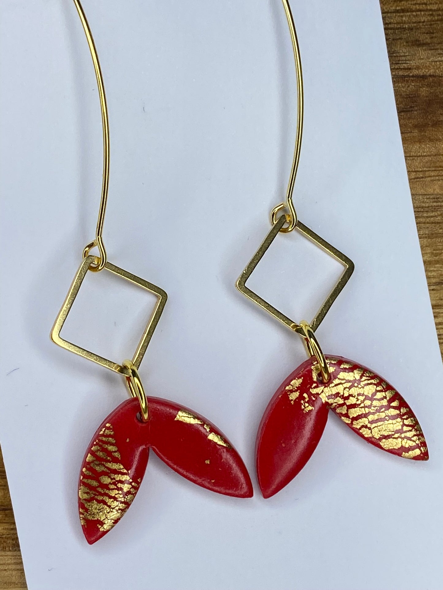 Statement dangles - red and gold fish tail with gold metal rhombus