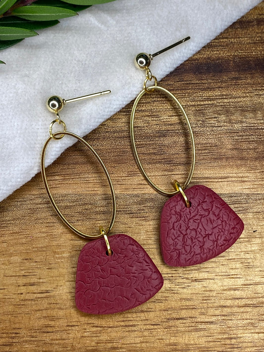 Statement dangles - textured burgundy rounded trapeziums with gold oval
