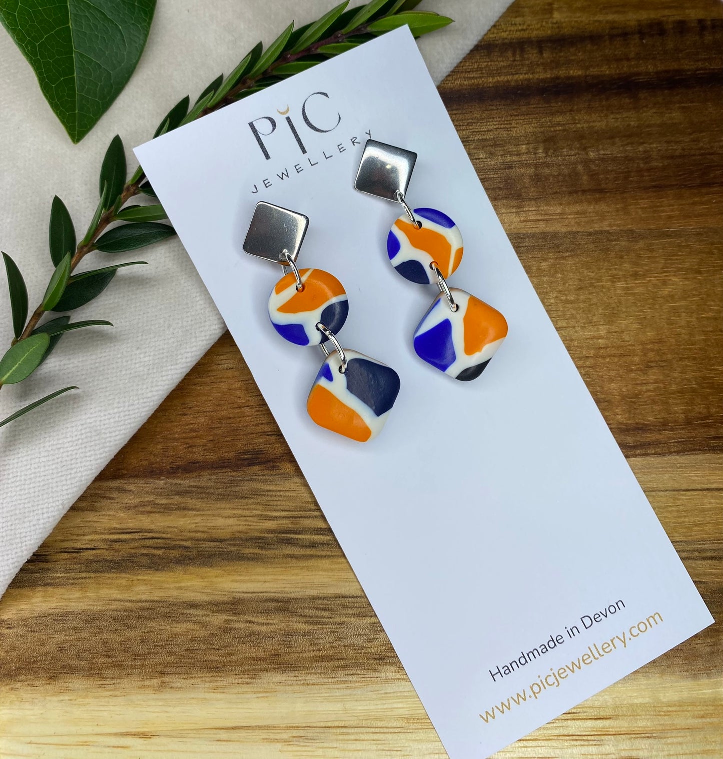 Statement dangles - blue, orange, white and black mix rhombus and circles