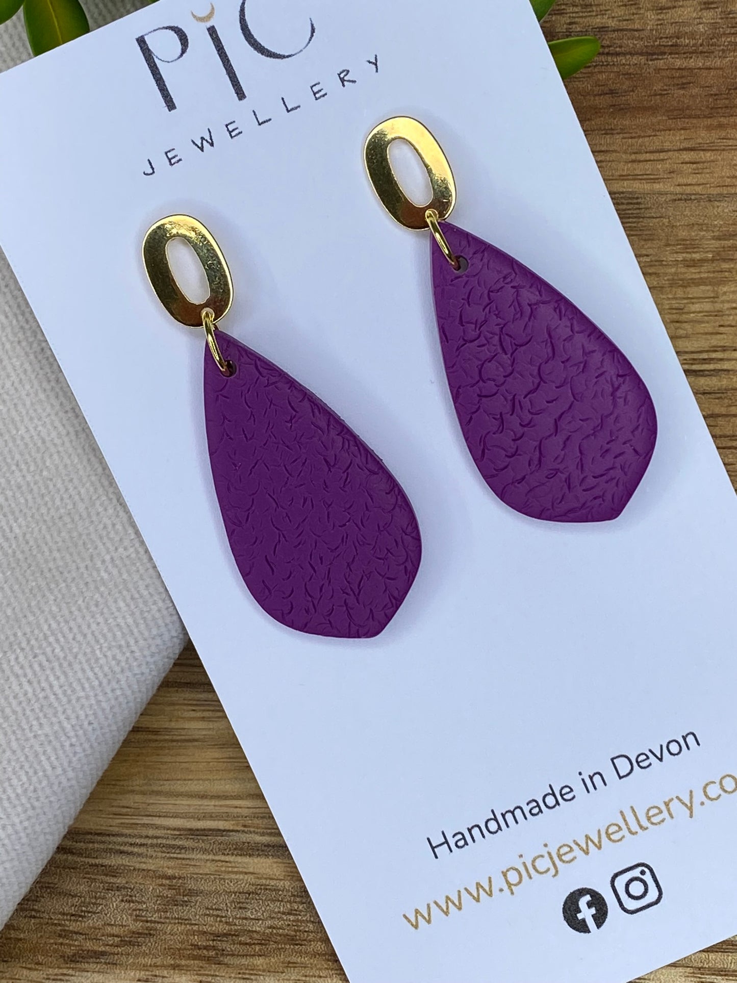 Medium dangles - textured purple teardrops on gold open oval studs