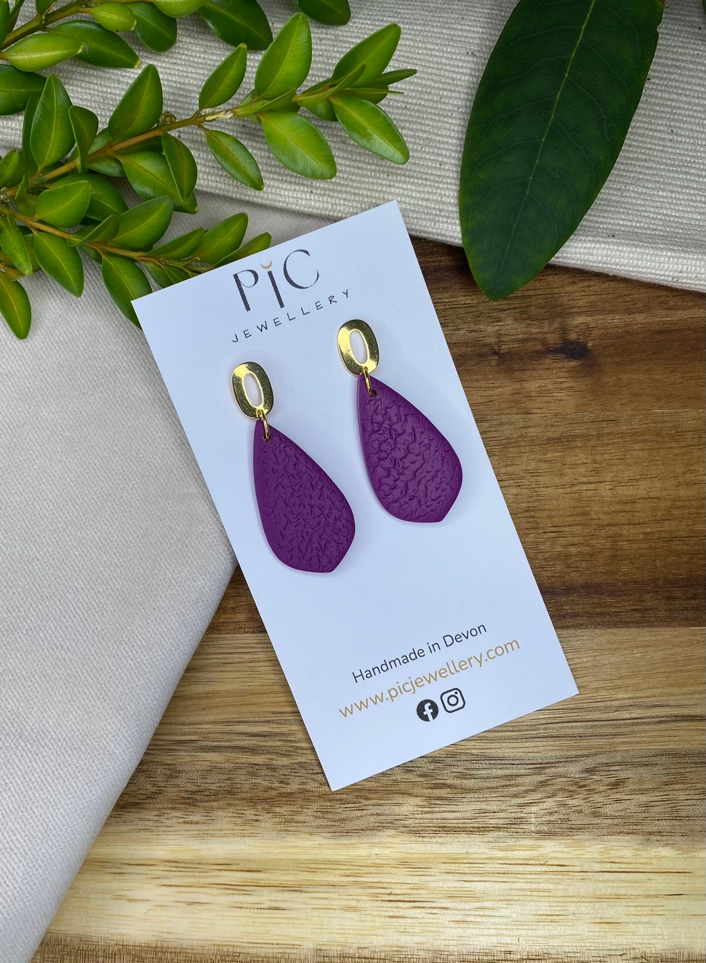 Medium dangles - textured purple teardrops on gold open oval studs