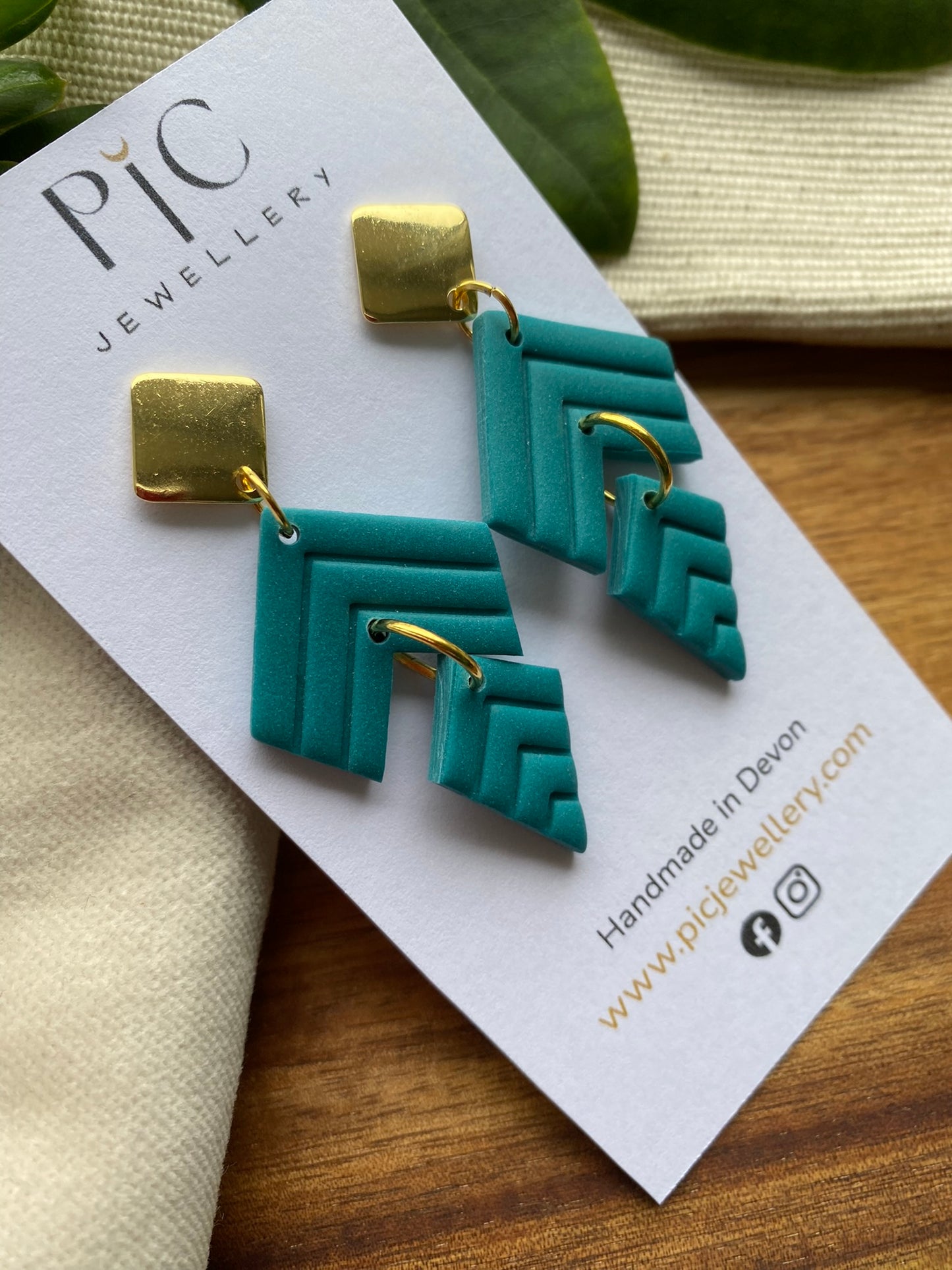 Statement dangles - teal chevron embossed split kite