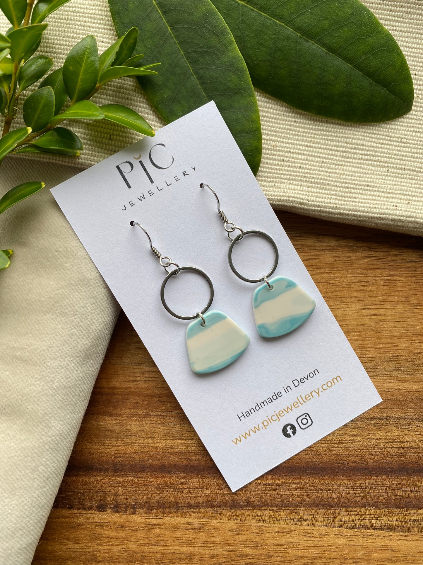 Statement dangles - teal and white rounded trapezium and silver circle