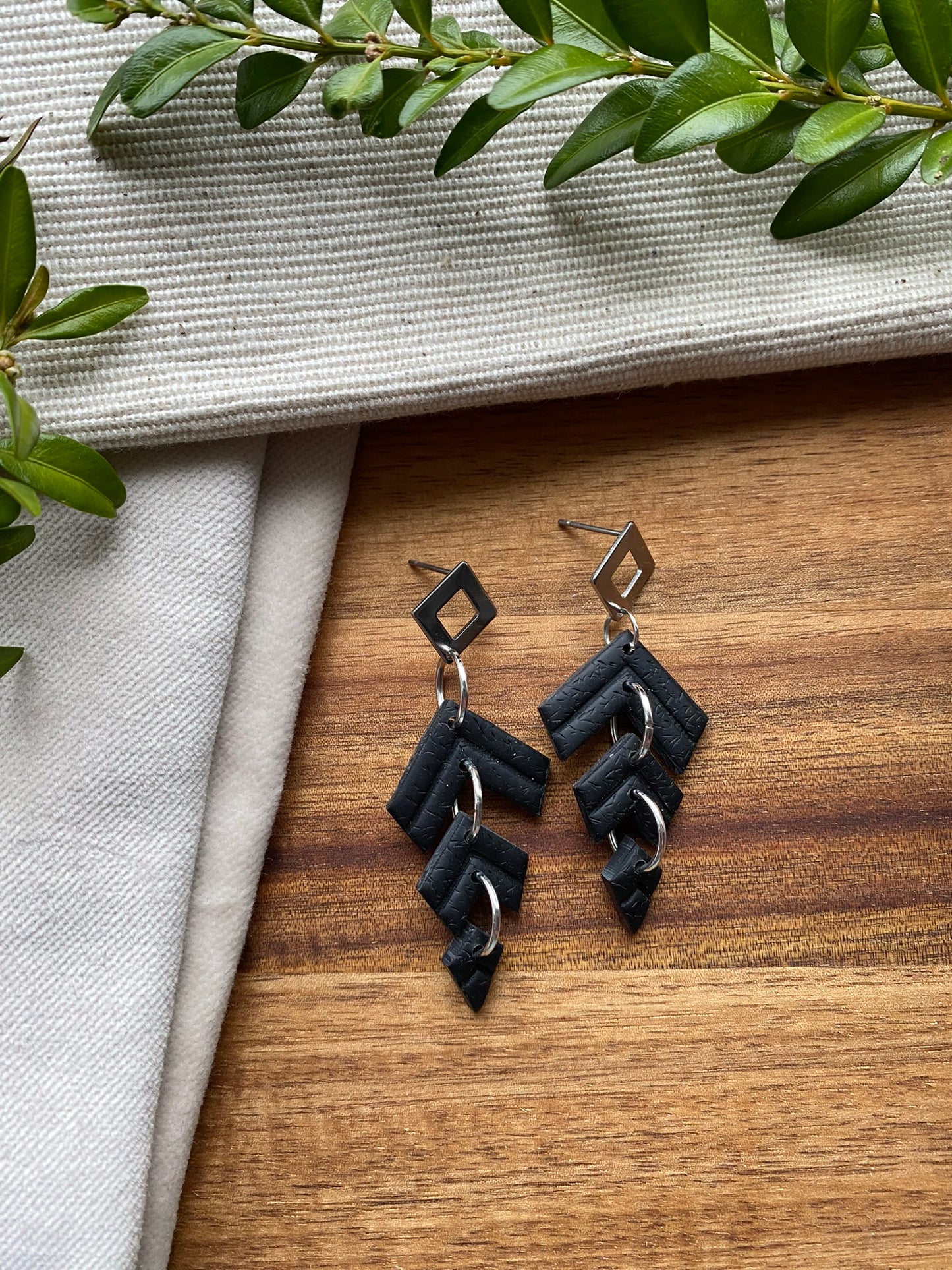 Statement dangles - black chevron embossed triple split kite