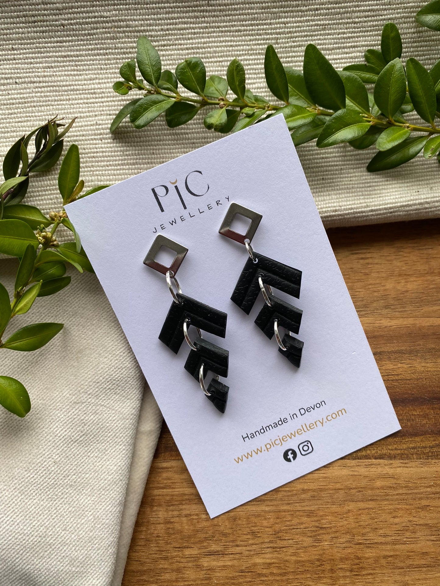 Statement dangles - black chevron embossed triple split kite