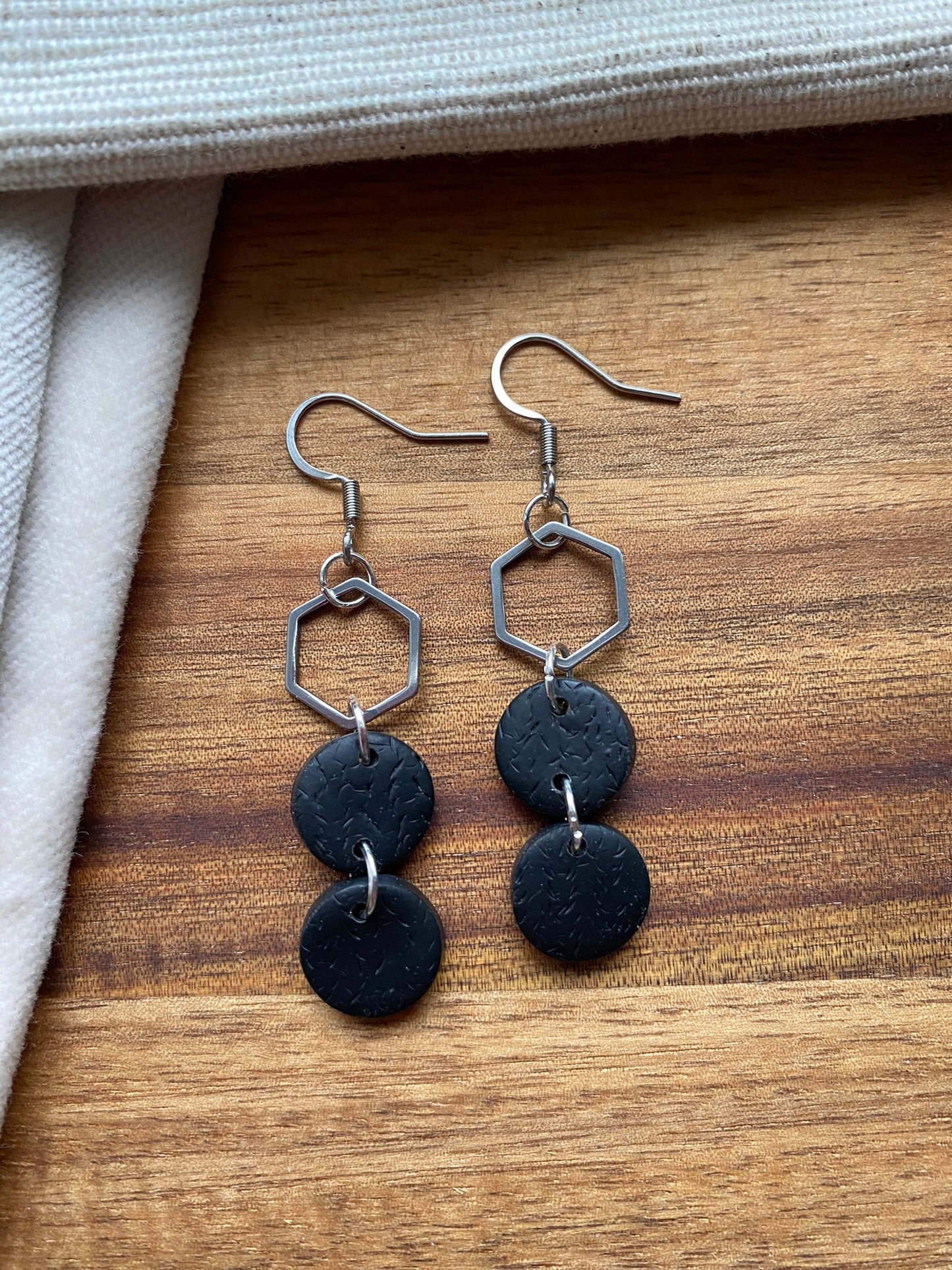 Statement dangles - textured black circles and stainless steel hexagon