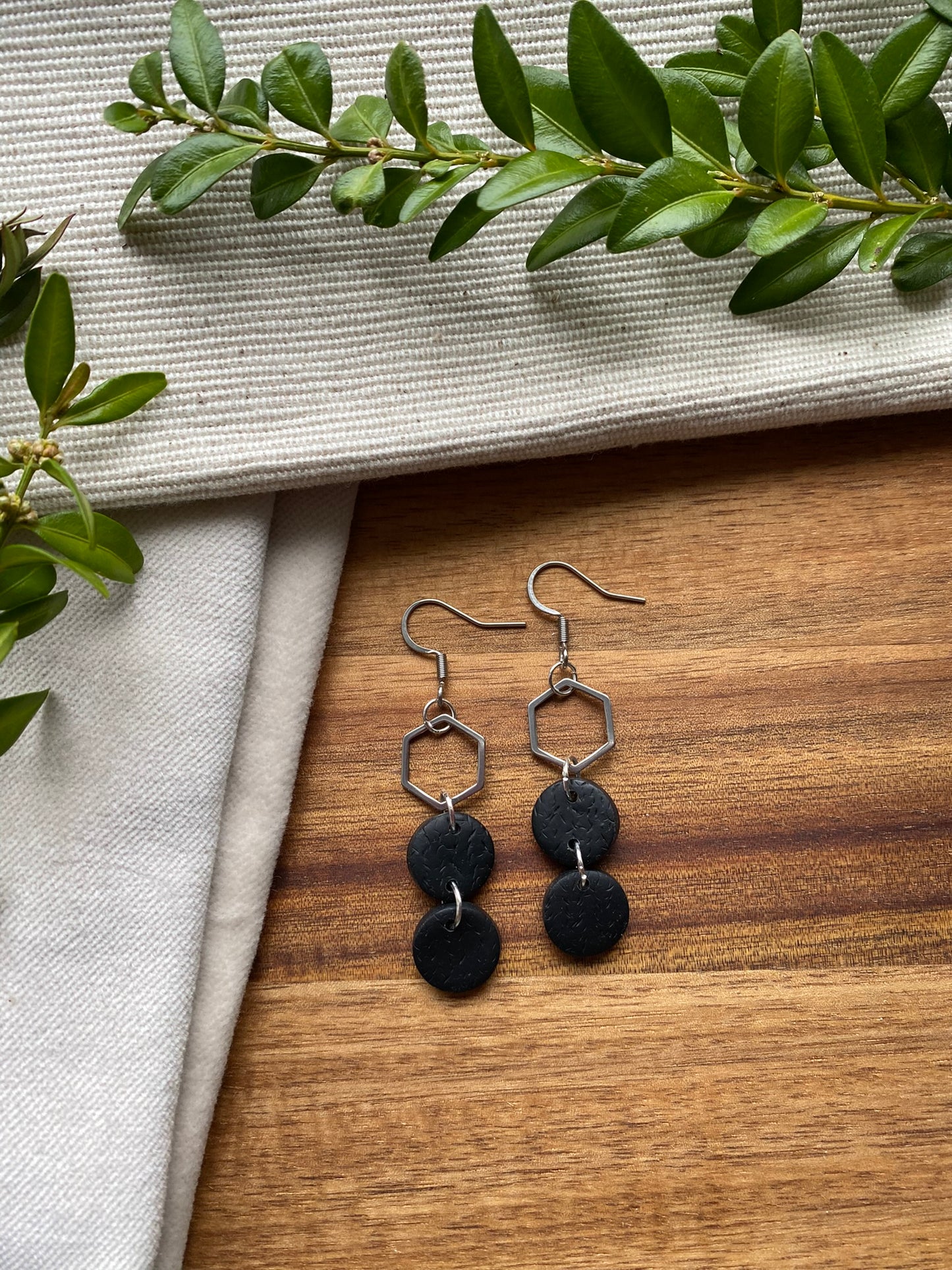 Statement dangles - textured black circles and stainless steel hexagon