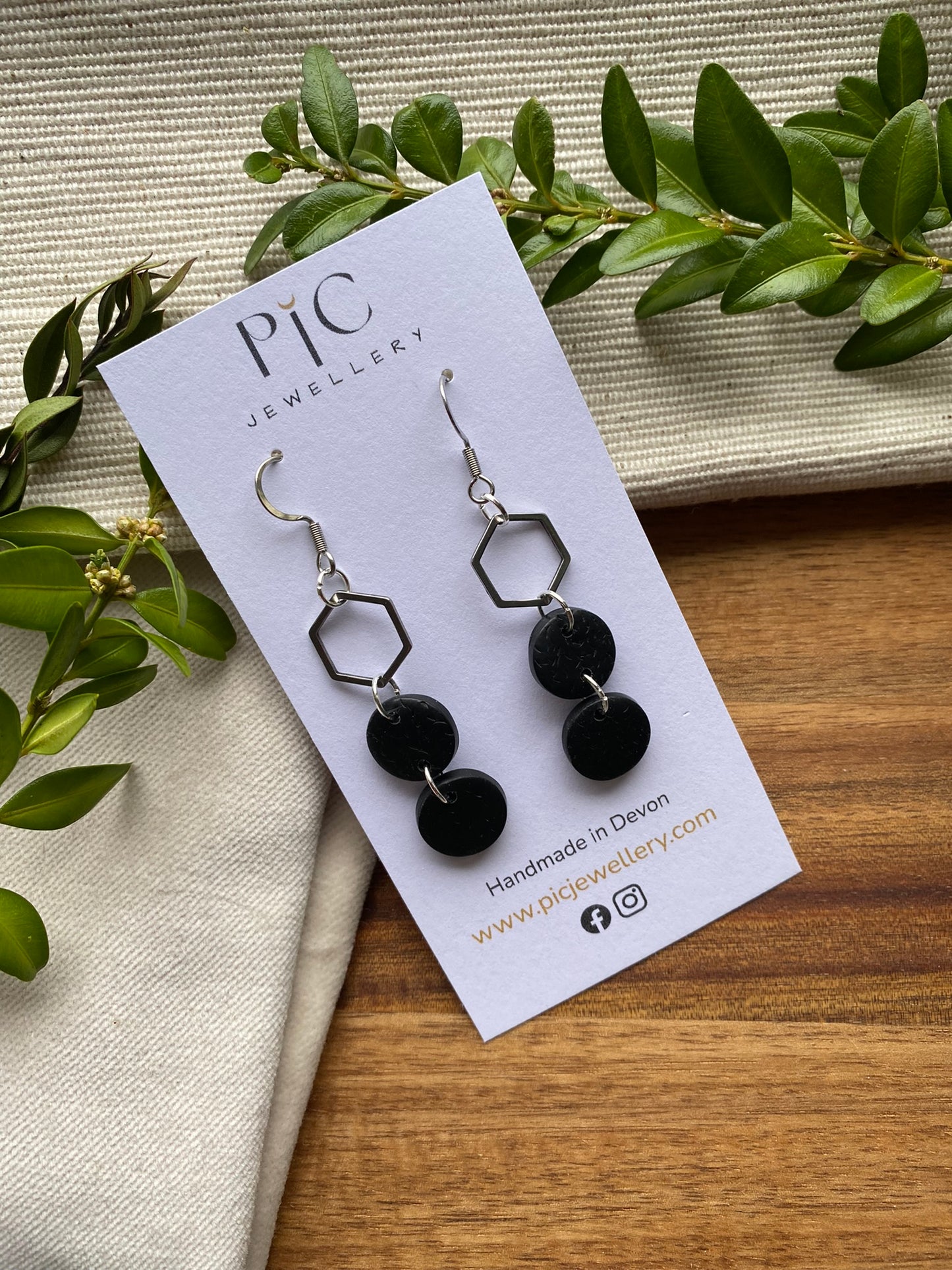 Statement dangles - textured black circles and stainless steel hexagon