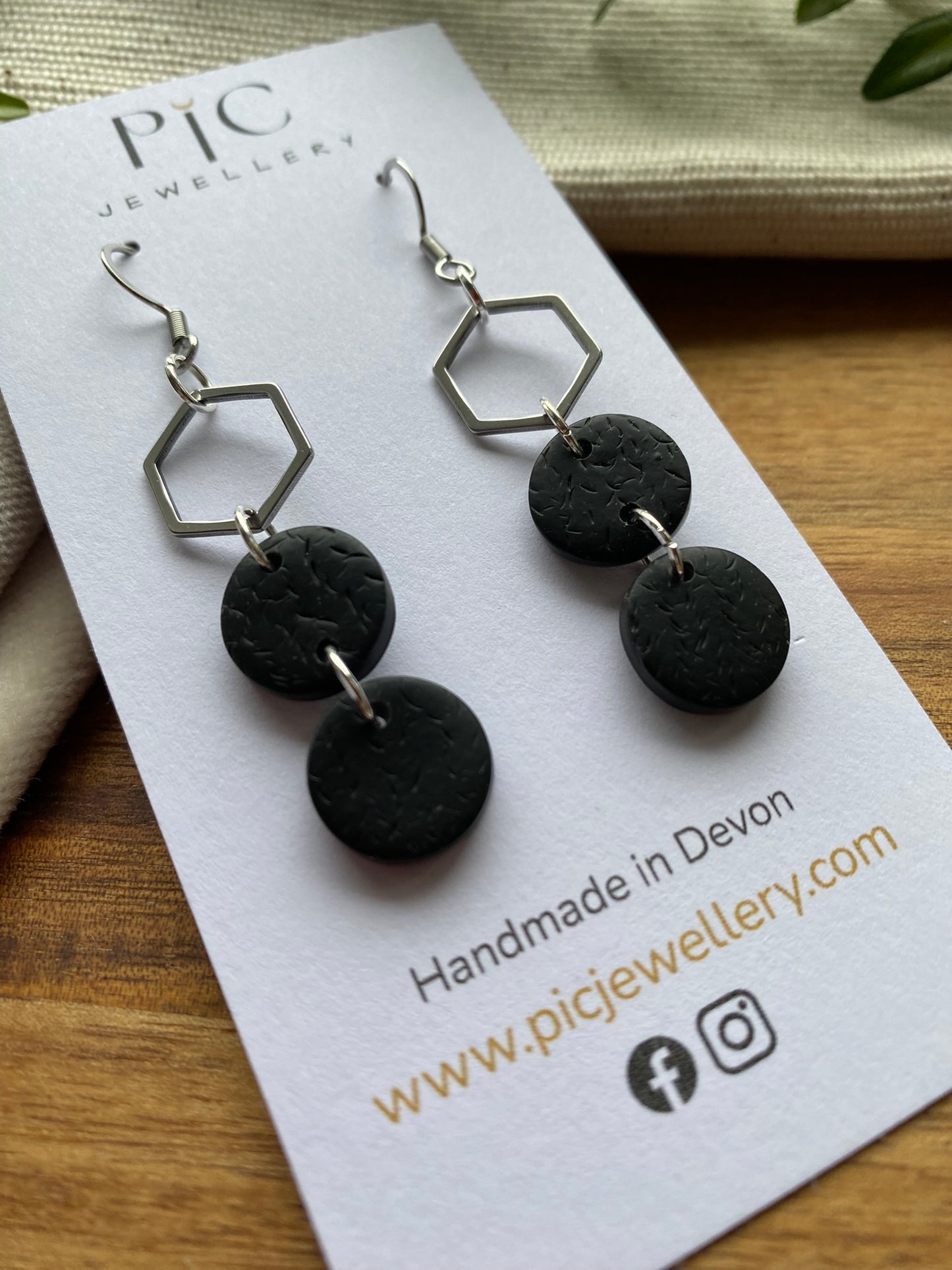 Statement dangles - textured black circles and stainless steel hexagon